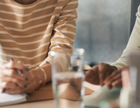 Two women collaborating over a desk